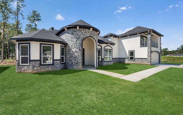 427 Rd 66111, Dayton, TX 77535 - french country style house featuring stone siding, a front lawn, and stucco siding