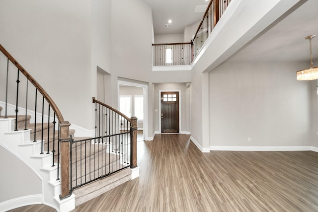 1831 Golden Cape Dr, Katy, TX 77494 - entrance foyer with wood finished floors, stairs, a high ceiling, and a chandelier