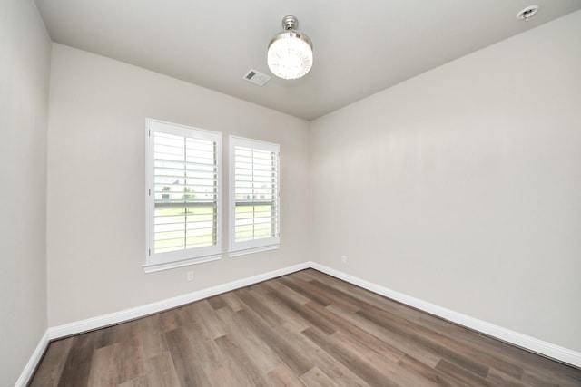 1831 Golden Cape Dr, Katy, TX 77494 - empty room with wood finished floors and a chandelier