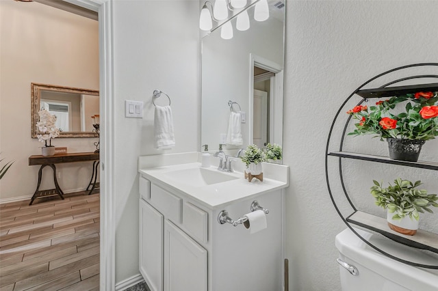 28638 Monarch Cliffs Dr, Fulshear, TX 77441 - half bathroom with wood finished floors and vanity