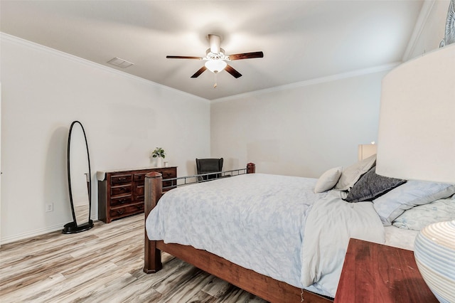 28638 Monarch Cliffs Dr, Fulshear, TX 77441 - bedroom featuring light wood finished floors, crown molding, and a ceiling fan