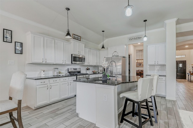 28638 Monarch Cliffs Dr, Fulshear, TX 77441 - kitchen featuring stainless steel appliances, white cabinetry, decorative backsplash, and ornamental molding