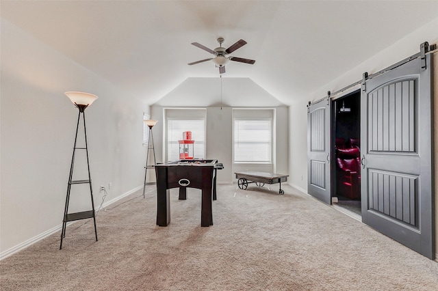 28638 Monarch Cliffs Dr, Fulshear, TX 77441 - game room with a barn door, ceiling fan, carpet, and vaulted ceiling