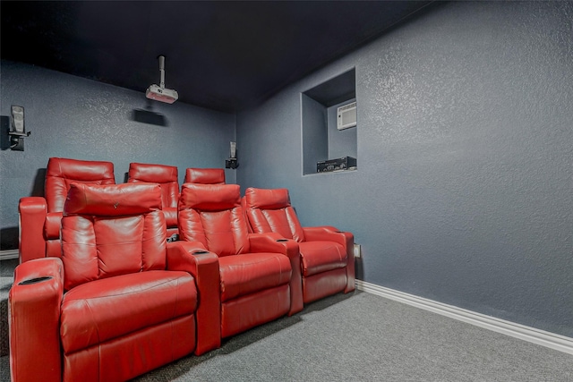 28638 Monarch Cliffs Dr, Fulshear, TX 77441 - carpeted home theater room with a textured wall and baseboards