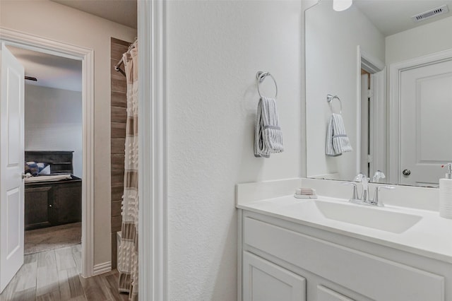 28638 Monarch Cliffs Dr, Fulshear, TX 77441 - full bath featuring vanity, wood finished floors, and a shower with curtain