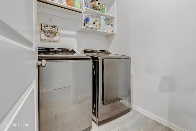 28638 Monarch Cliffs Dr, Fulshear, TX 77441 - washroom with washer and dryer and baseboards