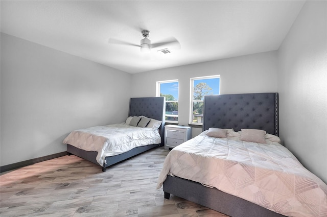 5215 Kelso St, Houston, TX 77021 - bedroom featuring wood finished floors and a ceiling fan