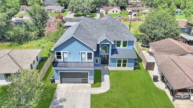 5215 Kelso St, Houston, TX 77021 - view of front of home featuring a residential view, stone siding, stucco siding, concrete driveway, and a front yard