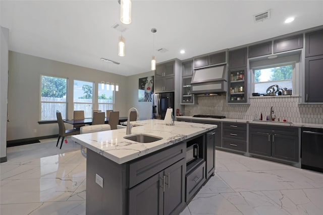 5215 Kelso St, Houston, TX 77021 - kitchen with black dishwasher, light marble finish floors, custom range hood, gas cooktop, and gray cabinets