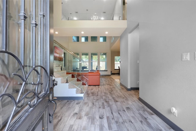 5215 Kelso St, Houston, TX 77021 - foyer entrance with light wood-style floors, stairs, and a high ceiling