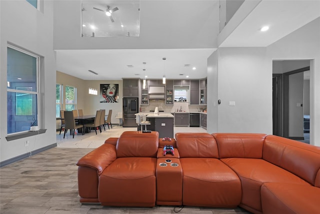 5215 Kelso St, Houston, TX 77021 - living area with a high ceiling, light wood-style floors, and recessed lighting