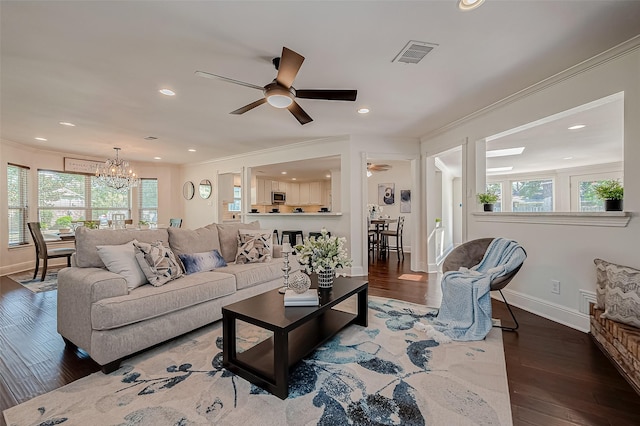 1714 Maux Dr, Houston, TX 77043 - living room featuring wood finished floors, a ceiling fan, ornamental molding, recessed lighting, and healthy amount of natural light