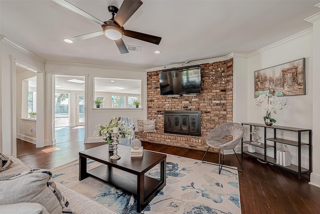 1714 Maux Dr, Houston, TX 77043 - living area with ceiling fan, wood-type flooring, a brick fireplace, crown molding, and recessed lighting