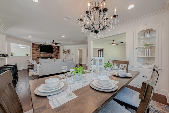 1714 Maux Dr, Houston, TX 77043 - dining area with a ceiling fan, crown molding, wood finished floors, recessed lighting, and a chandelier