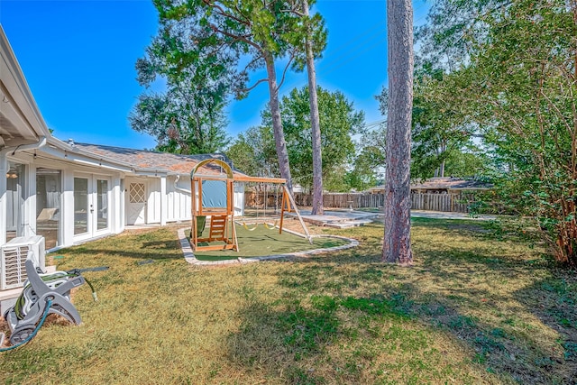 1714 Maux Dr, Houston, TX 77043 - fenced backyard featuring french doors and a playground