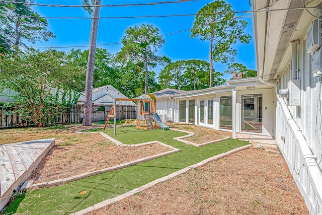 1714 Maux Dr, Houston, TX 77043 - fenced backyard featuring a playground and a sunroom