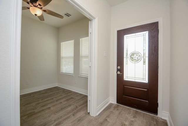 803 Cherokee Dr, Conroe, TX 77316 - entrance foyer with wood finished floors and a ceiling fan