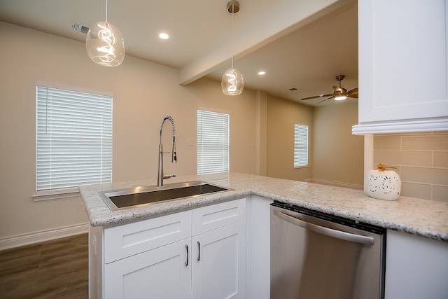 803 Cherokee Dr, Conroe, TX 77316 - kitchen with stainless steel dishwasher, tasteful backsplash, dark wood-type flooring, white cabinets, and recessed lighting