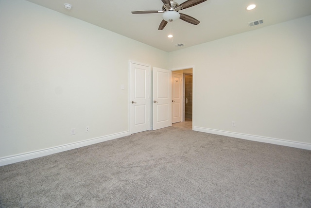 803 Cherokee Dr, Conroe, TX 77316 - spare room with light colored carpet, ceiling fan, a smoke detector, and recessed lighting
