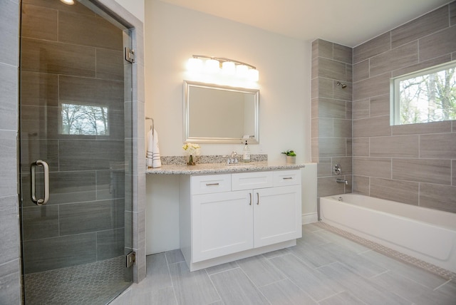 803 Cherokee Dr, Conroe, TX 77316 - full bath with vanity, tile patterned floors, and tiled shower / bath combo