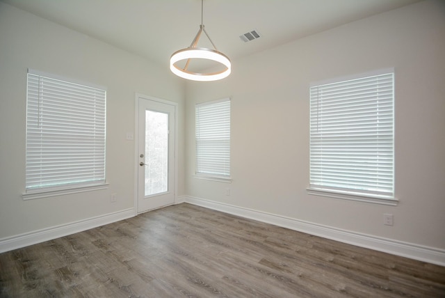803 Cherokee Dr, Conroe, TX 77316 - empty room featuring wood finished floors and baseboards