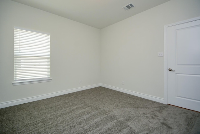 803 Cherokee Dr, Conroe, TX 77316 - carpeted empty room with healthy amount of natural light
