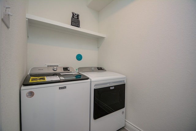 803 Cherokee Dr, Conroe, TX 77316 - washroom with washer and dryer