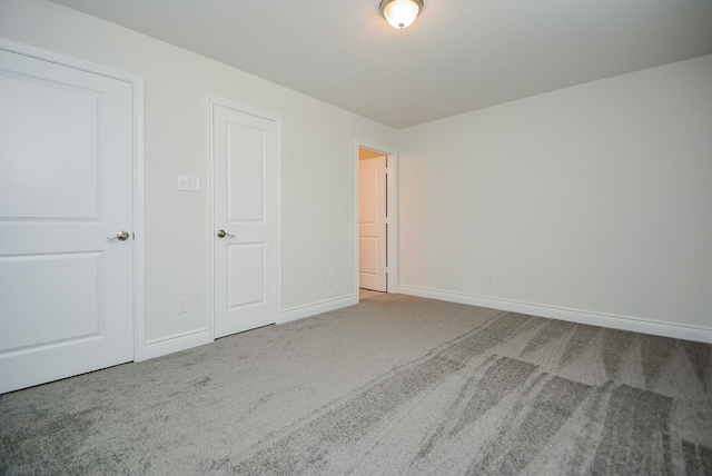 803 Cherokee Dr, Conroe, TX 77316 - unfurnished bedroom featuring carpet flooring and baseboards