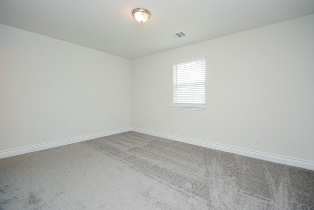 803 Cherokee Dr, Conroe, TX 77316 - empty room featuring carpet floors and baseboards