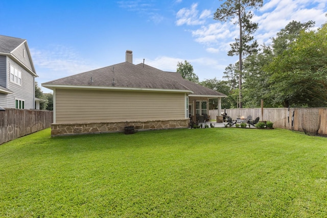 103 Jacks Corner Dr, Montgomery, TX 77316 - rear view of house with a patio area, a fenced backyard, a chimney, and roof with shingles