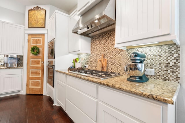 103 Jacks Corner Dr, Montgomery, TX 77316 - kitchen featuring exhaust hood, appliances with stainless steel finishes, white cabinetry, and tasteful backsplash