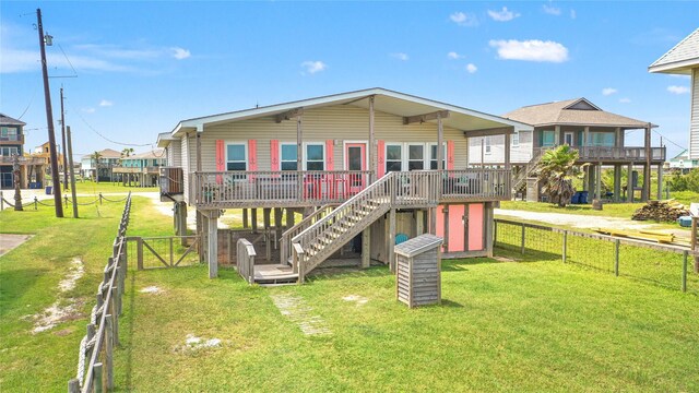 4630 Blue Water Hwy, Freeport, TX 77541 - back of house featuring stairway, a fenced backyard, and a deck