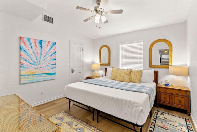 4630 Blue Water Hwy, Freeport, TX 77541 - bedroom featuring light wood-style flooring, lofted ceiling, and a ceiling fan