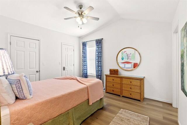 4630 Blue Water Hwy, Freeport, TX 77541 - bedroom featuring vaulted ceiling, light wood-style flooring, and ceiling fan