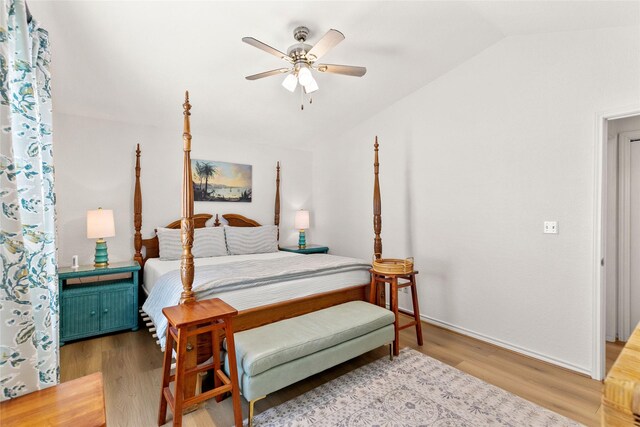 4630 Blue Water Hwy, Freeport, TX 77541 - bedroom with lofted ceiling, wood finished floors, and a ceiling fan