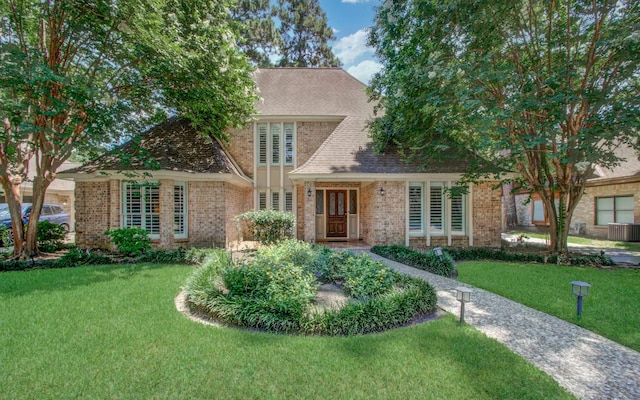 6711 Pebble Beach Dr, Houston, TX 77069 - view of front of property with a front lawn and brick siding
