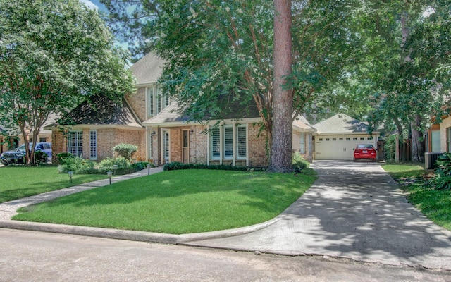 6711 Pebble Beach Dr, Houston, TX 77069 - view of front of house featuring a front lawn, driveway, brick siding, and a garage