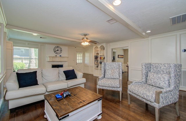 6711 Pebble Beach Dr, Houston, TX 77069 - living area featuring a decorative wall, dark wood finished floors, crown molding, a fireplace, and ceiling fan