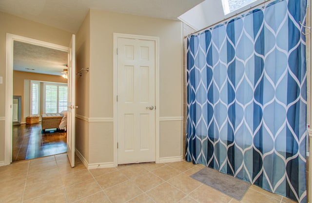 6711 Pebble Beach Dr, Houston, TX 77069 - bathroom featuring tile patterned flooring and a shower with shower curtain