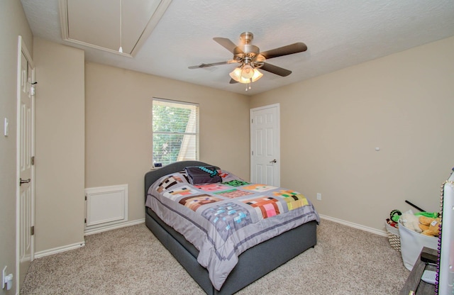 6711 Pebble Beach Dr, Houston, TX 77069 - carpeted bedroom featuring attic access and a ceiling fan