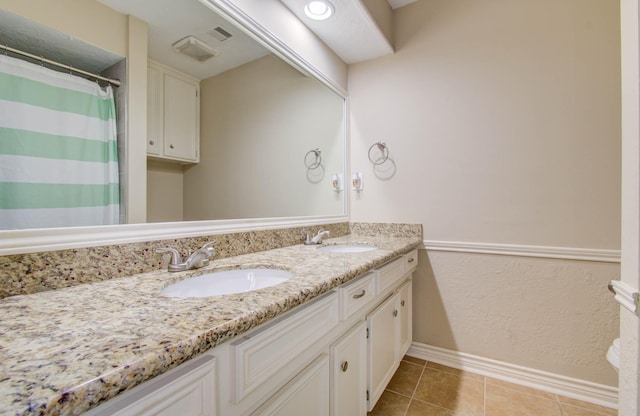 6711 Pebble Beach Dr, Houston, TX 77069 - bathroom featuring double vanity, tile patterned floors, and a shower with shower curtain