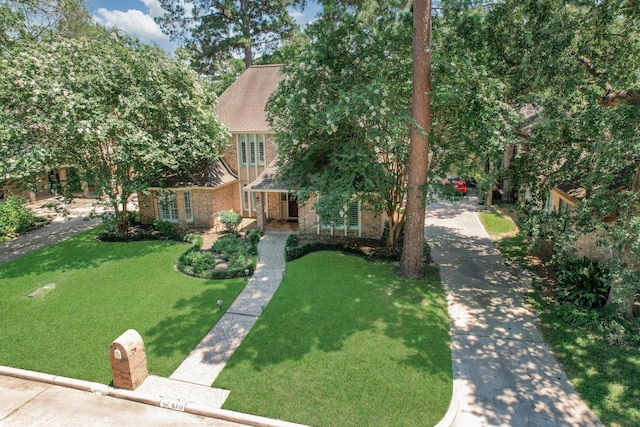 6711 Pebble Beach Dr, Houston, TX 77069 - view of front of home with brick siding and a front yard