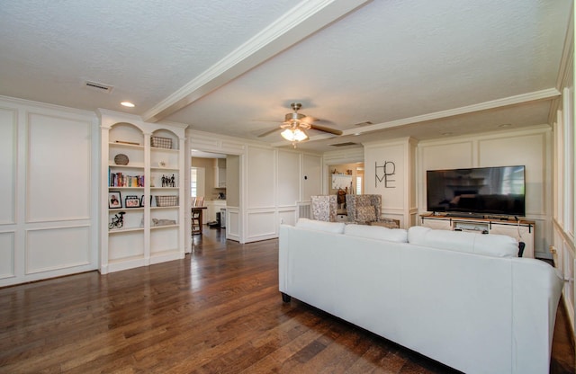 6711 Pebble Beach Dr, Houston, TX 77069 - living area with a textured ceiling, a decorative wall, dark wood finished floors, crown molding, and a ceiling fan