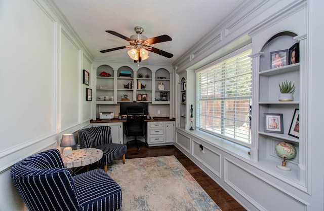 6711 Pebble Beach Dr, Houston, TX 77069 - office with ceiling fan, a decorative wall, built in desk, and ornamental molding