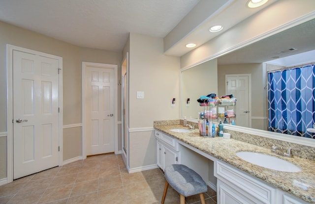 6711 Pebble Beach Dr, Houston, TX 77069 - full bathroom featuring double vanity, a shower with shower curtain, tile patterned floors, and recessed lighting