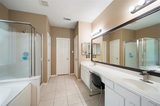 18 S April Mist Cir, The Woodlands, TX 77385 - full bathroom featuring a shower stall, double vanity, tile patterned floors, and a garden tub