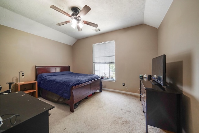 18 S April Mist Cir, The Woodlands, TX 77385 - bedroom with vaulted ceiling, light carpet, and a ceiling fan