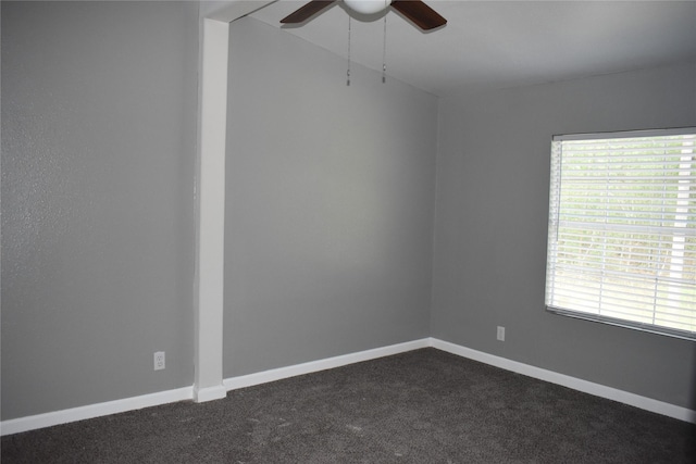 25 Wood Gln, Trinity, TX 75862 - spare room with ceiling fan and dark colored carpet