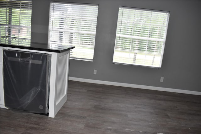 25 Wood Gln, Trinity, TX 75862 - interior space featuring baseboards and dark wood-style flooring