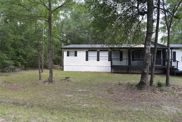 25 Wood Gln, Trinity, TX 75862 - manufactured / mobile home featuring a front lawn and covered porch